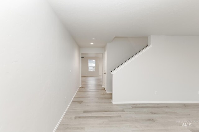 672 S Jayo Ct, Emmett, ID 83617 - unfurnished living room with ceiling fan, light hardwood / wood-style flooring, a healthy amount of sunlight, and sink