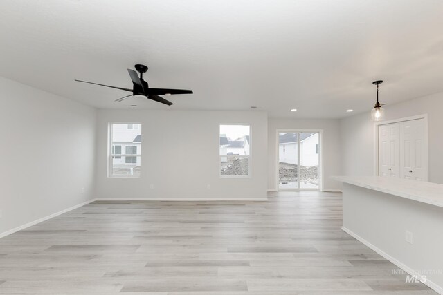 672 S Jayo Ct, Emmett, ID 83617 - kitchen with tasteful backsplash, a center island, light wood-type flooring, and appliances with stainless steel finishes