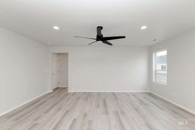 672 S Jayo Ct, Emmett, ID 83617 - kitchen featuring ceiling fan, stainless steel appliances, light hardwood / wood-style flooring, backsplash, and a kitchen island