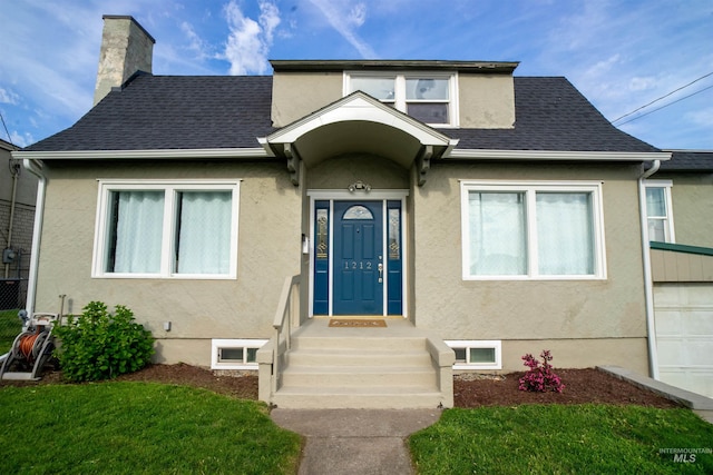 1212 14th St, Lewiston, ID 83501 - view of front of property with a chimney, roof with shingles, and stucco siding