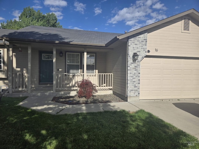 single story home featuring a porch, an attached garage, and brick siding