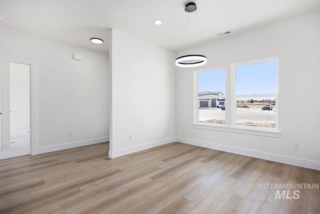 unfurnished dining area featuring light wood-type flooring, baseboards, visible vents, and recessed lighting