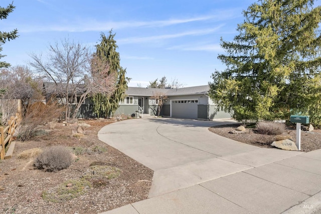 ranch-style house with stucco siding, driveway, and a garage