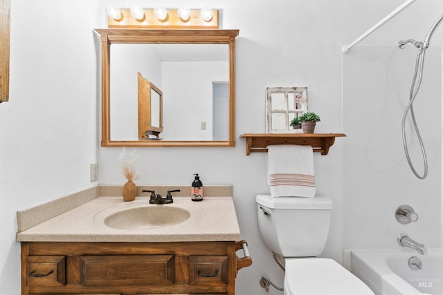 bathroom featuring tub / shower combination, toilet, and vanity