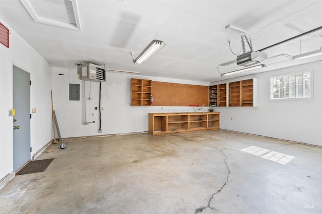 garage featuring electric panel, a heating unit, and a garage door opener