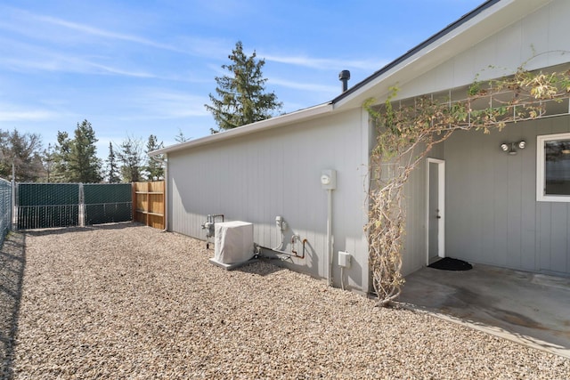 view of side of property with fence