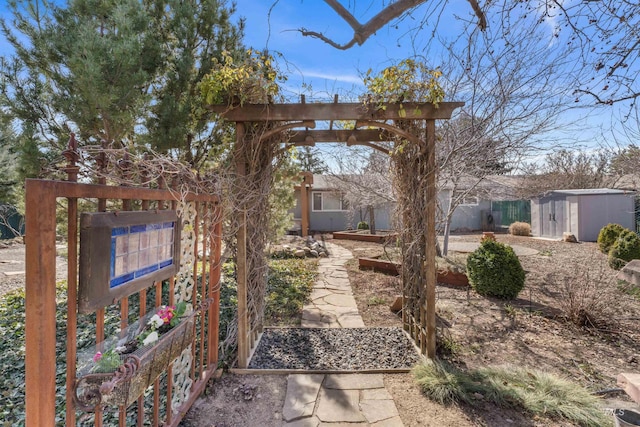 view of yard featuring a storage unit and an outdoor structure