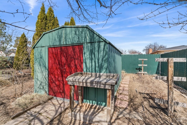 view of outdoor structure with an outdoor structure and fence