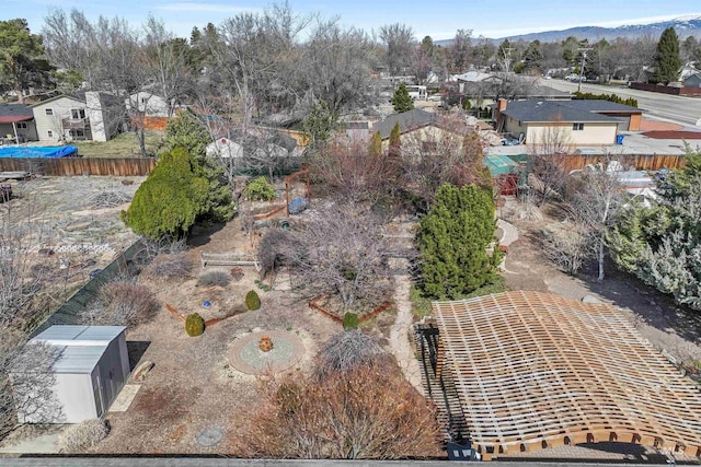 aerial view featuring a mountain view and a residential view