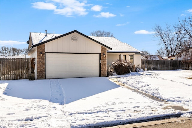 ranch-style house featuring a garage