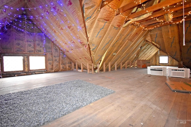 attic featuring an AC wall unit