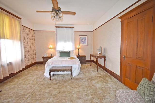 carpeted bedroom with baseboards