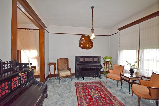 sitting room featuring light colored carpet