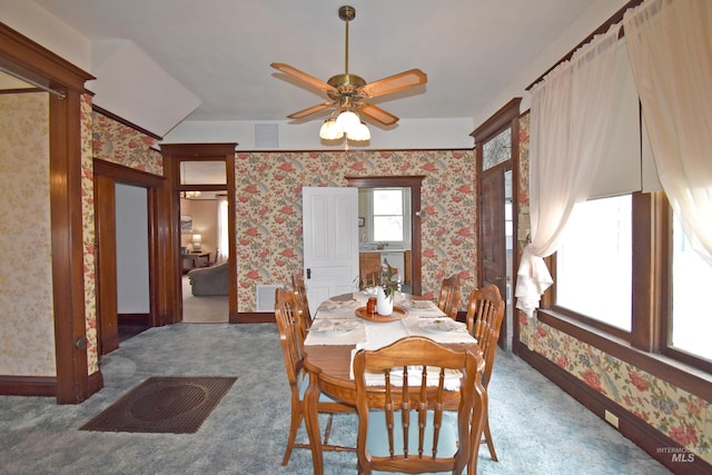 dining area featuring carpet flooring, visible vents, and wallpapered walls