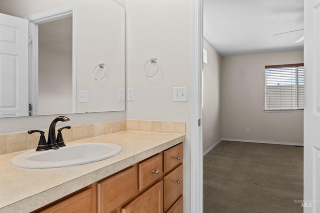 bathroom with vanity and baseboards