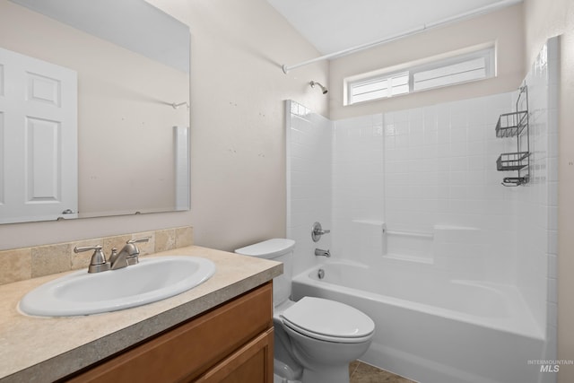 bathroom featuring vanity,  shower combination, and toilet