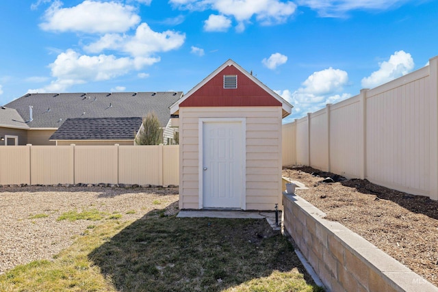 view of shed with a fenced backyard