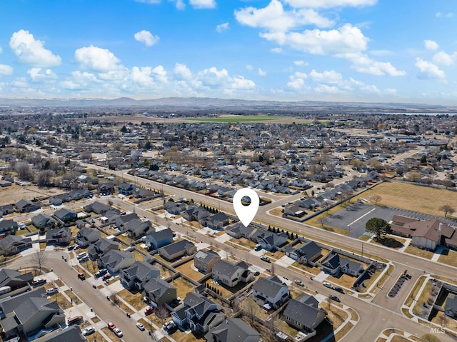 drone / aerial view with a residential view and a mountain view