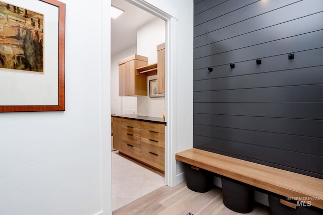 mudroom with light wood-style floors