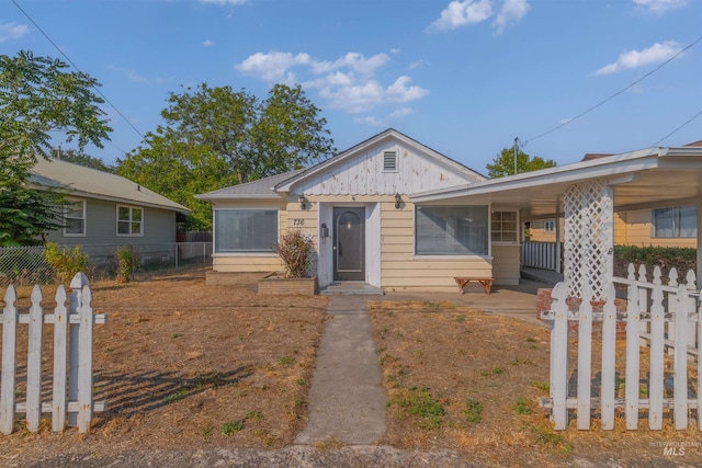 view of front of home with a carport