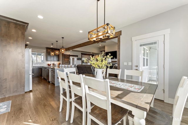 dining space featuring recessed lighting and dark wood finished floors