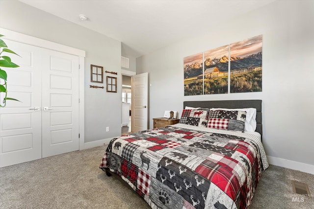 carpeted bedroom with visible vents and baseboards