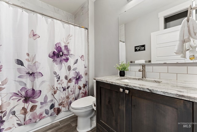 full bath featuring shower / bath combo, vanity, toilet, and wood tiled floor