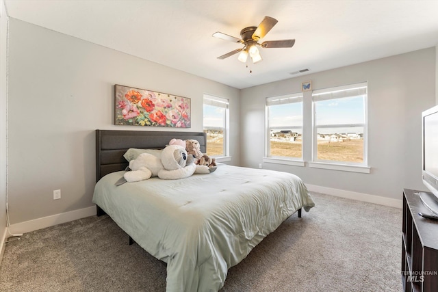 bedroom featuring carpet flooring, visible vents, and baseboards