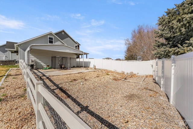 exterior space with a fenced backyard and a patio