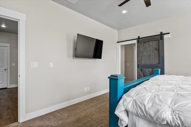 27985 Gray Sage Rd, Caldwell, ID 83607 - carpeted bedroom with a barn door, baseboards, recessed lighting, and ceiling fan