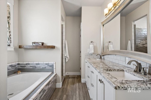 27985 Gray Sage Rd, Caldwell, ID 83607 - bathroom with a bath, baseboards, and double vanity