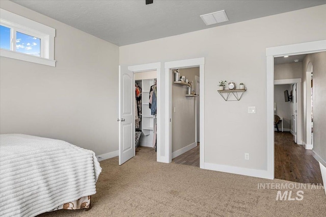 27985 Gray Sage Rd, Caldwell, ID 83607 - carpeted bedroom featuring baseboards and a walk in closet