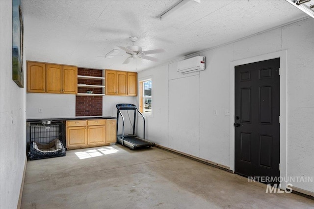 27985 Gray Sage Rd, Caldwell, ID 83607 - garage featuring a wall mounted air conditioner and ceiling fan
