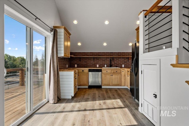 27985 Gray Sage Rd, Caldwell, ID 83607 - kitchen featuring dishwasher, light wood-style flooring, a sink, light brown cabinets, and brick wall