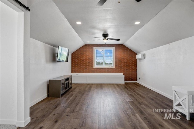 27985 Gray Sage Rd, Caldwell, ID 83607 - bonus room featuring ceiling fan, wood finished floors, baseboards, brick wall, and lofted ceiling