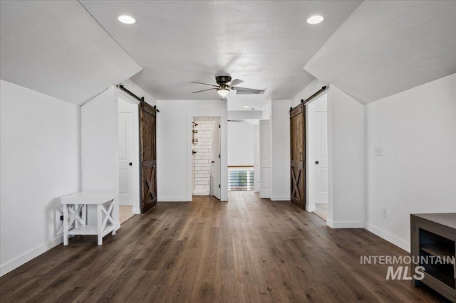 27985 Gray Sage Rd, Caldwell, ID 83607 - bonus room with a barn door, a ceiling fan, baseboards, wood finished floors, and recessed lighting