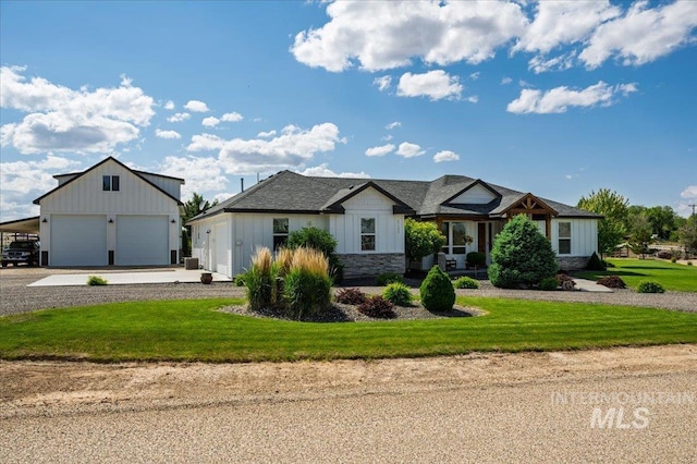 27985 Gray Sage Rd, Caldwell, ID 83607 - modern inspired farmhouse with board and batten siding, a front yard, an outbuilding, and gravel driveway