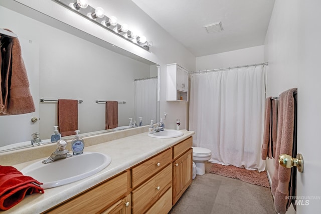 full bathroom with a sink, toilet, double vanity, and visible vents