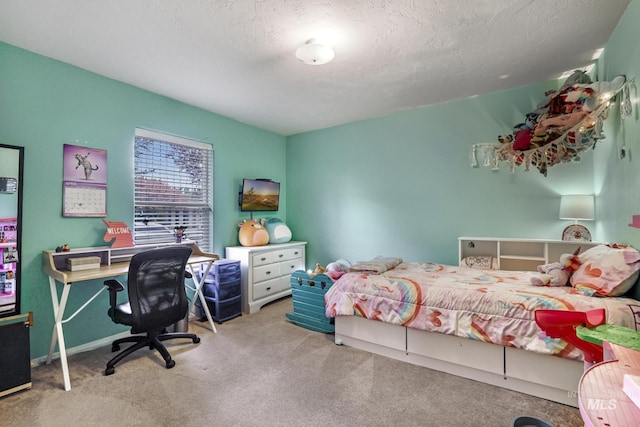 bedroom featuring a textured ceiling and carpet