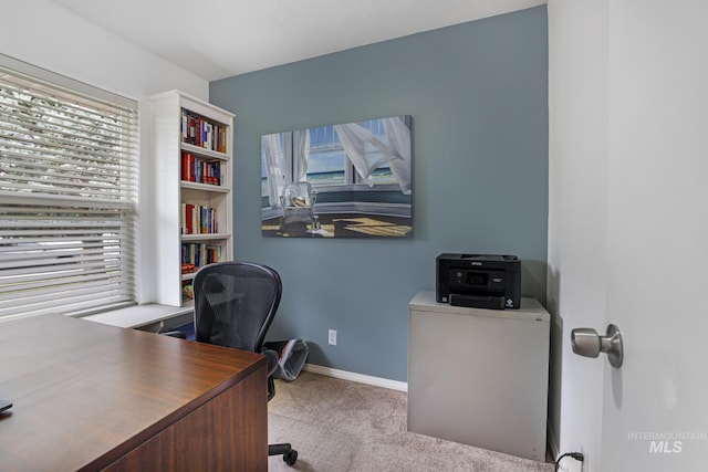 office space with carpet floors and baseboards