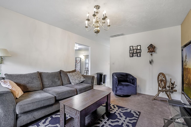 carpeted living area with a notable chandelier and visible vents