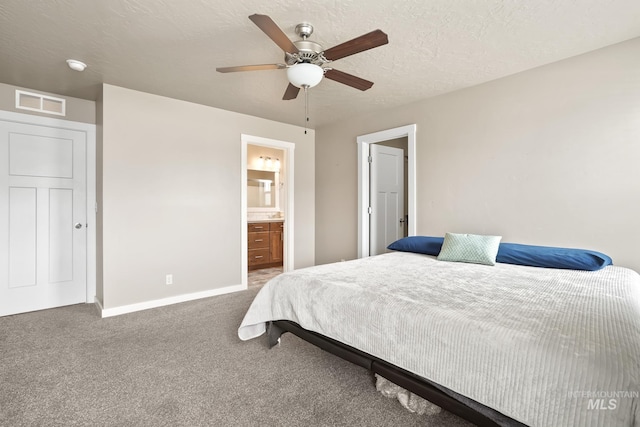 319 Magnolia Ave, Fruitland, ID 83619 - carpeted bedroom with baseboards, ceiling fan, and ensuite bathroom