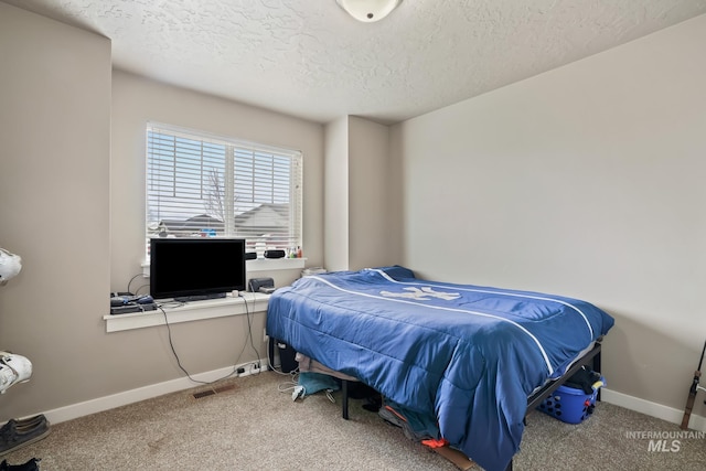 319 Magnolia Ave, Fruitland, ID 83619 - carpeted bedroom featuring a textured ceiling and baseboards