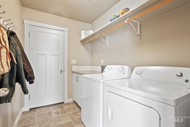 319 Magnolia Ave, Fruitland, ID 83619 - washroom featuring baseboards, cabinet space, washer and dryer, and a textured ceiling
