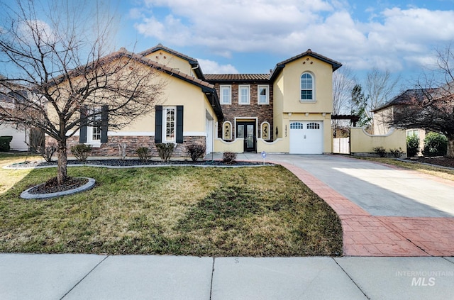 view of front facade featuring concrete driveway, an attached garage, stone siding, and stucco siding