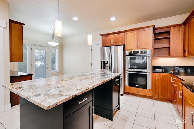 kitchen featuring a kitchen island, dark stone countertops, appliances with stainless steel finishes, brown cabinetry, and open shelves