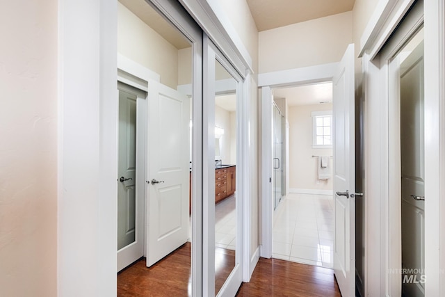 corridor with dark wood-type flooring