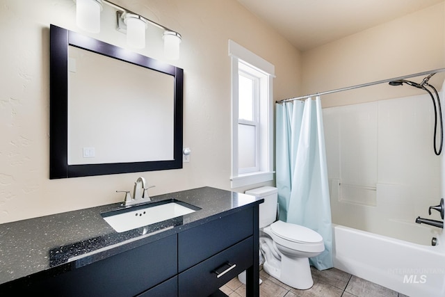 bathroom featuring toilet, shower / bath combination with curtain, vanity, and tile patterned flooring