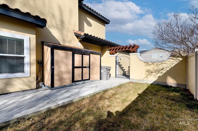 exterior space with fence and a gate