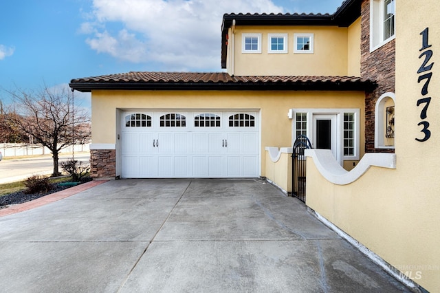 exterior space with concrete driveway